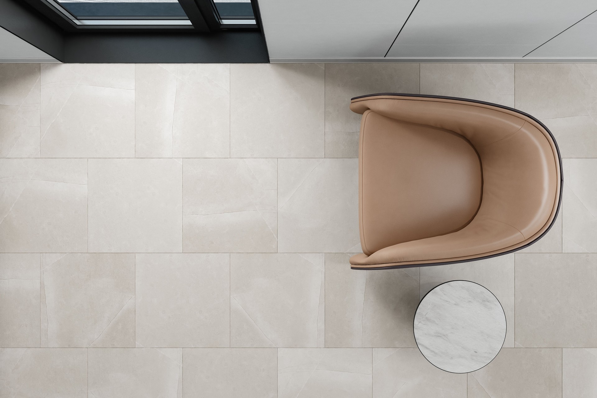 Top-Down View of Modern Living Space with Armchair and Matte Stone Tile Flooring